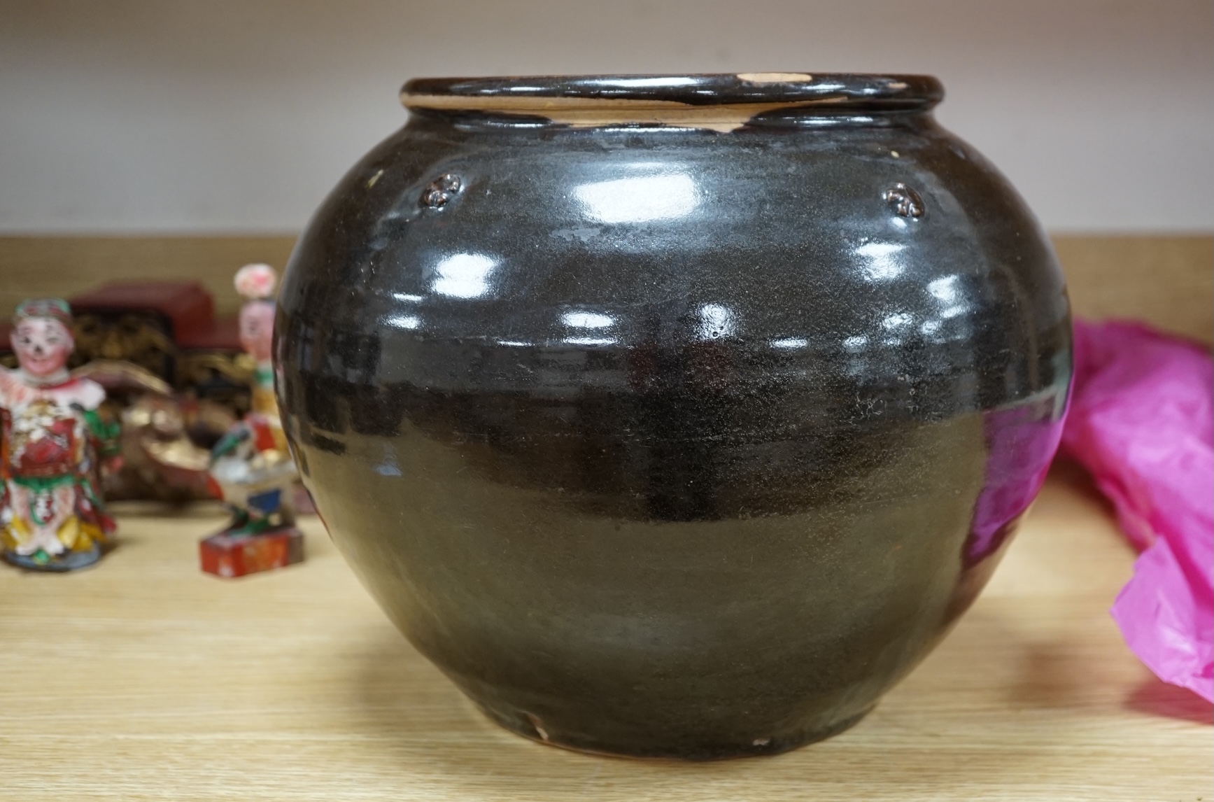 A Chinese Henan black glazed jar, Song dynasty, 23cm high. Condition - some glazing missing in manufacturing